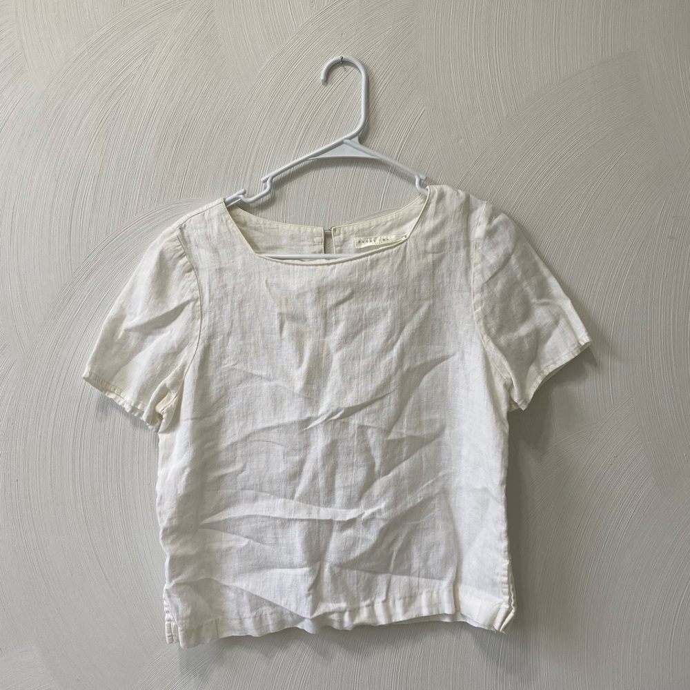 white, somewhat cropped shirt